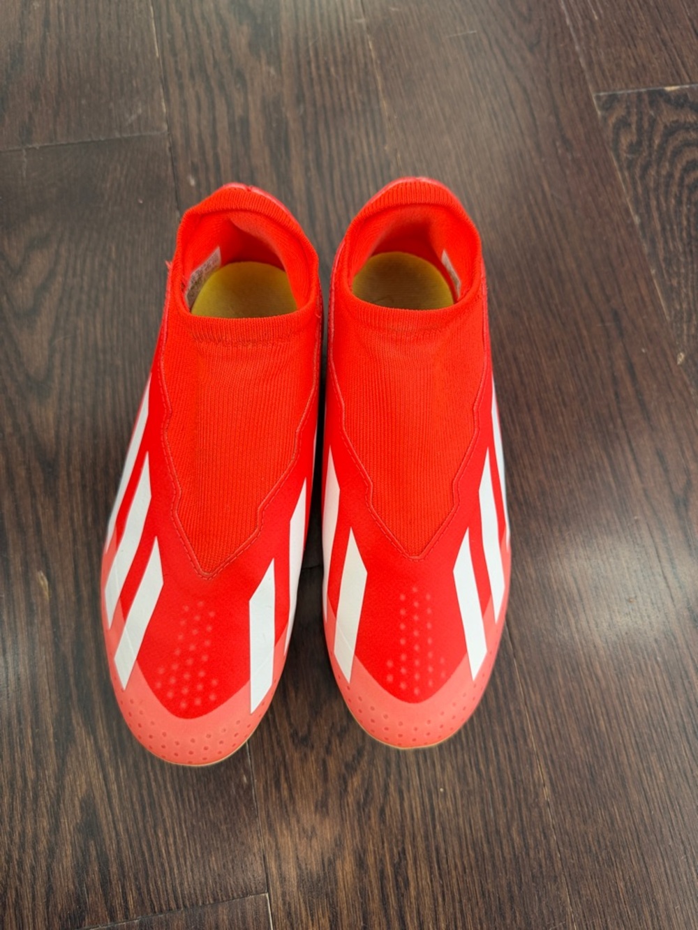 Nike Kids Red Slip-On Soccer Cleats with White Stripes